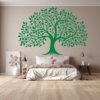 Generations Bloom Family Tree Wall Decal in a Bed Room. Green coloured family tree displayed on a wall just above a bed.