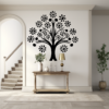 Soulful Unity Family Tree Wall Mural in a Home. Black wall sticker on a white wall just above a small table with a vase, map and other decorative items. The staircase is to the left and a potted plant to the right.