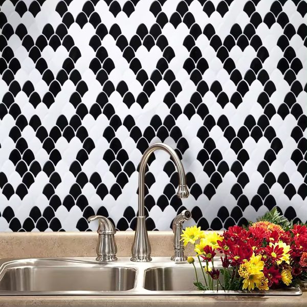 Black and White Fish Scale tile backsplash installed on the wall of a kitchen.