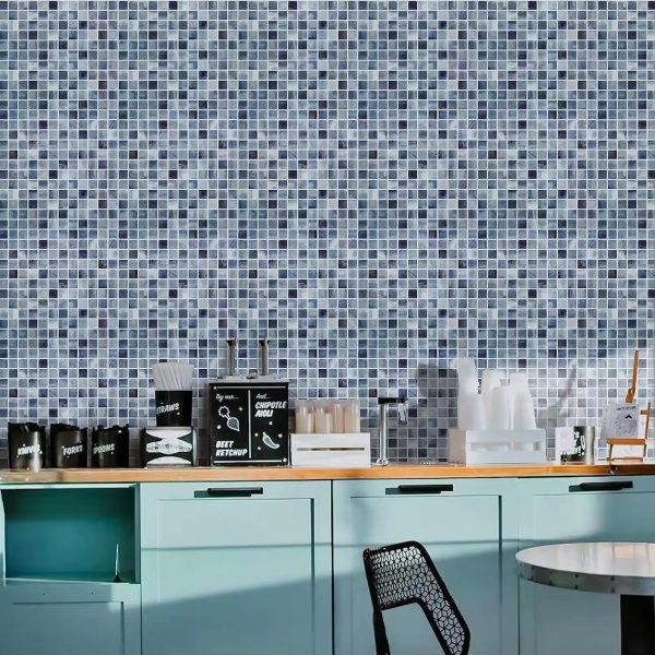 Blue Mosaic Squares tile backsplash installed on the wall of a kitchen with green wooden cabinets and wooden countertop.